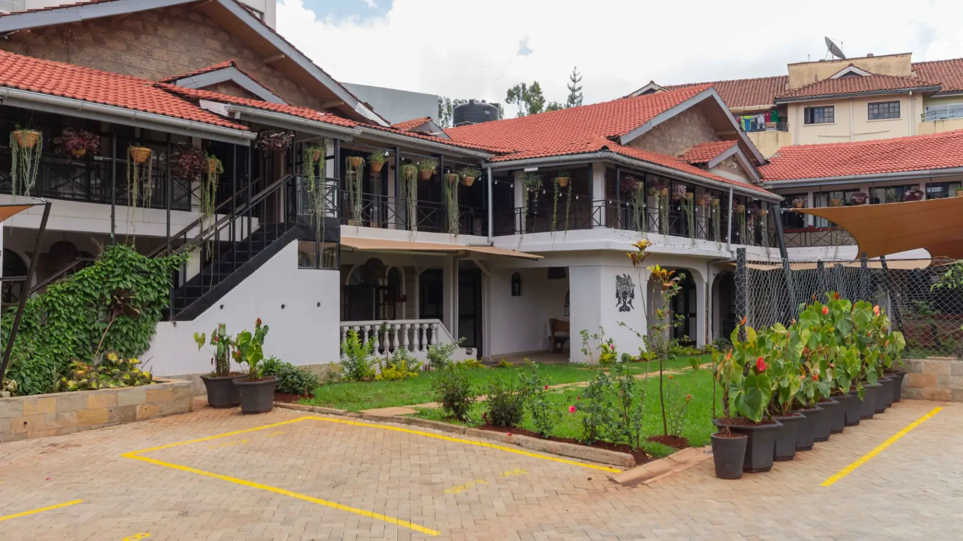 Trisan Resident Hotel building and garden in Kilimani, Nairobi