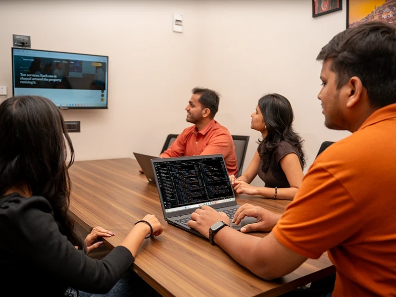 Website Design: Our team working on a hotel website. Caption: Your warm welcome begins online.